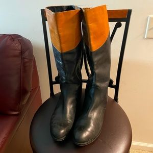 Black and tan leather riding boots that zip on the side, great condition